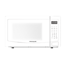 Frigidaire microwave, white front with keypad and digital clock display