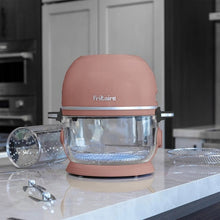 Fritaire pink air fryer with clear bowl and mesh accessories