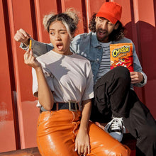 Variety pack snack bags with Doritos, Lay's, and Cheetos held by people