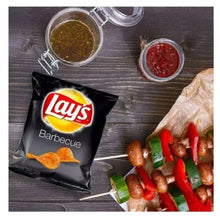 Lay’s Barbecue chips bag with salsa cups and vegetable skewers