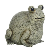Light gray frog garden statue in a seated pose, speckled texture and round eyes