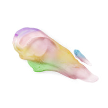 Scoop of pastel whipped shave body butter on a spreading applicator
