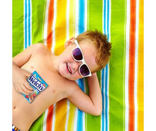 Welch's Mixed Fruit Fruit Snacks pouch held by child on colorful striped blanket