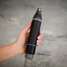Black handheld vacuum attachment with clear nozzle top and ribbed hose, blue ring