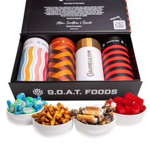 Assorted candy gift set box with four open canisters of colorful sweets
