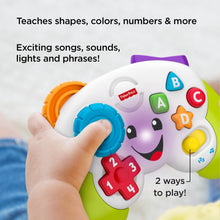 White learning controller toy with purple handle, blue button ring, and colorful keys