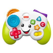 Green-and-white learning controller toy with smiley face buttons and number pads