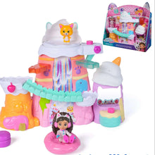 Colorful sweet treat mountain toy playset with small figure and accessories, pink and orange.