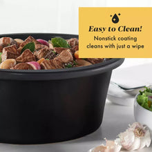 Black oval crock insert with cooked food inside slow cooker
