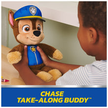 Chase take-along buddy plush held upright, brown fur face and blue uniform