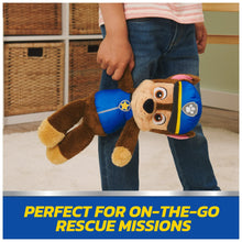 Chase take-along buddy plush carried on a child’s arm, brown fur and blue uniform