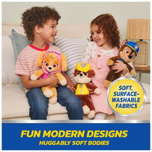 Chase take-along buddy plush with brown fur and blue uniform, held by a child