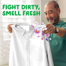 Liquid detergent marketing image: man holding a white shirt with purple flower graphic