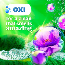 Laundry detergent pacs with Oxi bubbles and purple flower in green splash