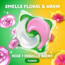 Pink and green detergent flings with rose and hibiscus scent theme on packaging insert