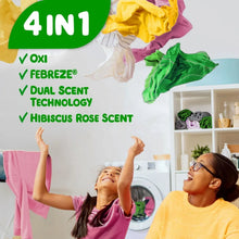 Person hanging colorful laundry in a bright room, with washing machine in view