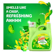 Green fabric softener jug with AromaBoost label and floral sprigs