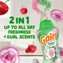 Laundry scent booster beads bottle with green and pink design, cherry and rose accents