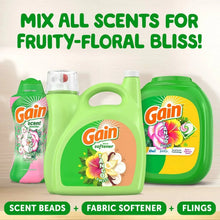 Three Gain fabric care bottles: scent beads, fabric softener, and flings
