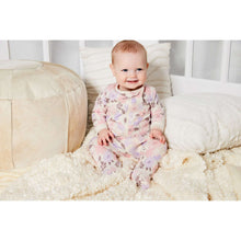 Newborn baby wearing long-sleeve floral cotton footed romper