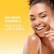 Woman smiling with skincare cleansing foam on cheek in a micellar formula ad