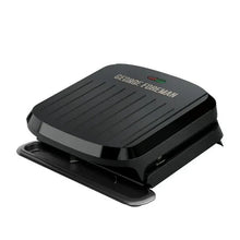 George Foreman nonstick grill with ribbed cooking plates, lid open