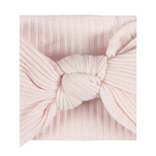 Light pink ribbed baby headband with centered bow
