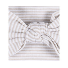 Beige striped baby headband with tied bow detail
