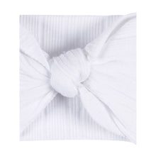 White baby headband with knot bow and soft textured fabric