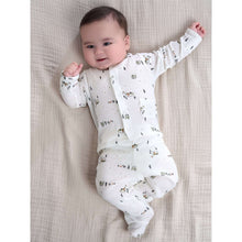Baby wearing preemie ivory animal-print footed outfit with long sleeves