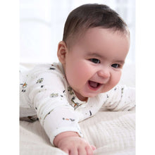 Baby wearing preemie ivory animal-print long-sleeve outfit with elastic cuffs