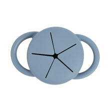 Light blue baby snack cup lid top with cross-shaped vent and side handles.
