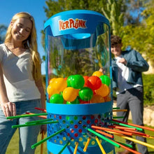 KerPlunk giant game close-up: clear cylinder filled with colorful balls and blue top
