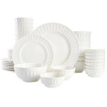 Embossed white porcelain dinnerware set with plates, bowls, and cups