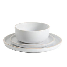 White coupe bowl stacked with matching plate and saucer