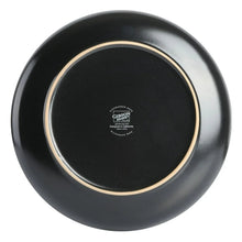 Gibson Home round dinnerware set—underside of black plate with gold ring and logo