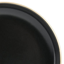 Gibson Home round dinnerware set—close-up of black plate with gold rim