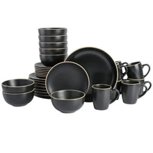 Gibson Home round dinnerware set—black bowls, plates, and mugs with gold trim
