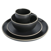 Gibson Home round dinnerware set—black cup, bowl, and plate with gold rim
