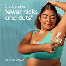 Woman shaving with a disposable Venus Simply 3 razor