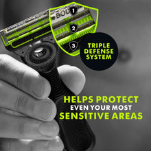 Men’s body razor with black ridged handle and green cartridge blades, held by fingers