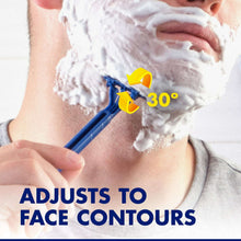 Blue disposable razor at 30-degree pivot on neck with shaving foam