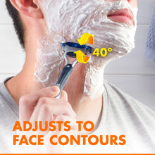 Disposable razor shaving with white lather on face, blue handle
