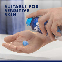 Shave gel dispensing onto open palm, blue gel drop