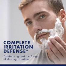 Shaving foam on face, hand spreading shave gel