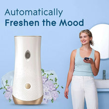 Glade automatic spray air freshener dispenser with Clean Linen refill and flowers