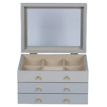 Gray lift-top jewelry box with open lid showing beige organizer compartments and three drawers