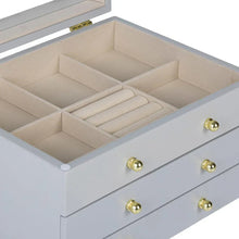 Gray lift-top jewelry box open top with beige compartments and gold knob handle on drawer