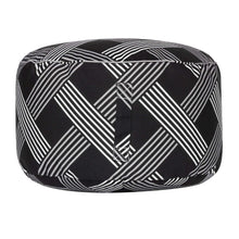 Cylindrical round pouf with black fabric and white diagonal stripe grid pattern