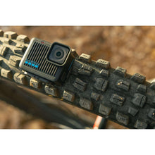 Action camera mounted on a rugged outdoor surface